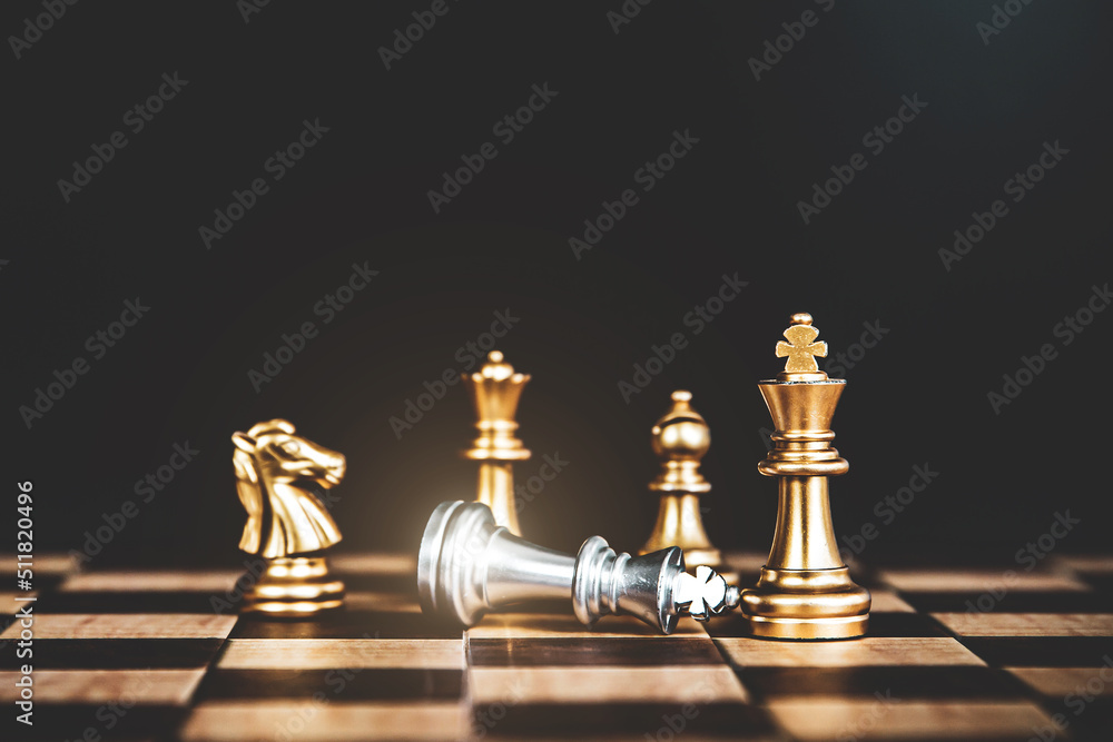 Close up king chess stand with falling chess concept of team player or business team and leadership strategy or strategic planning and human resources organization risk management.