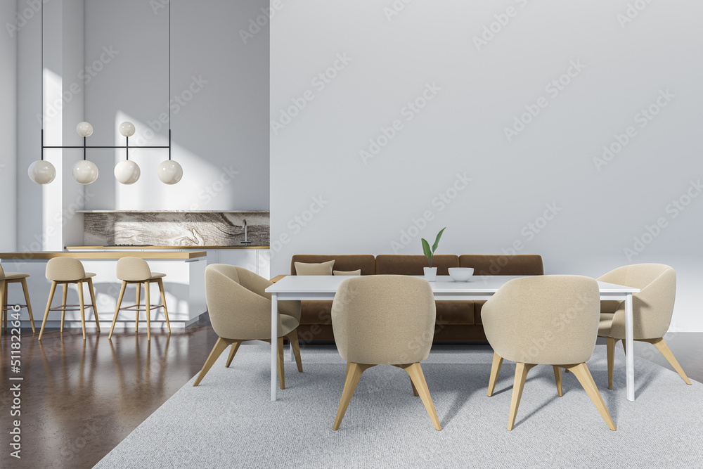 Light kitchen interior with eating table and couch, bar chairs. Mockup wall