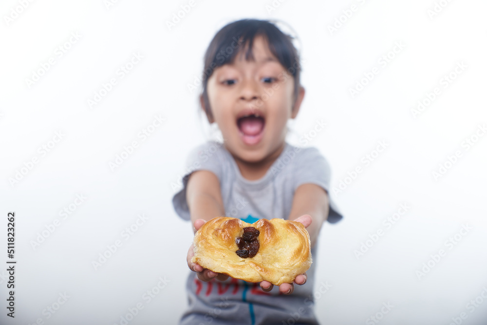 Asian little girl having breakfast in white background Asian little girl having breakfast in white background