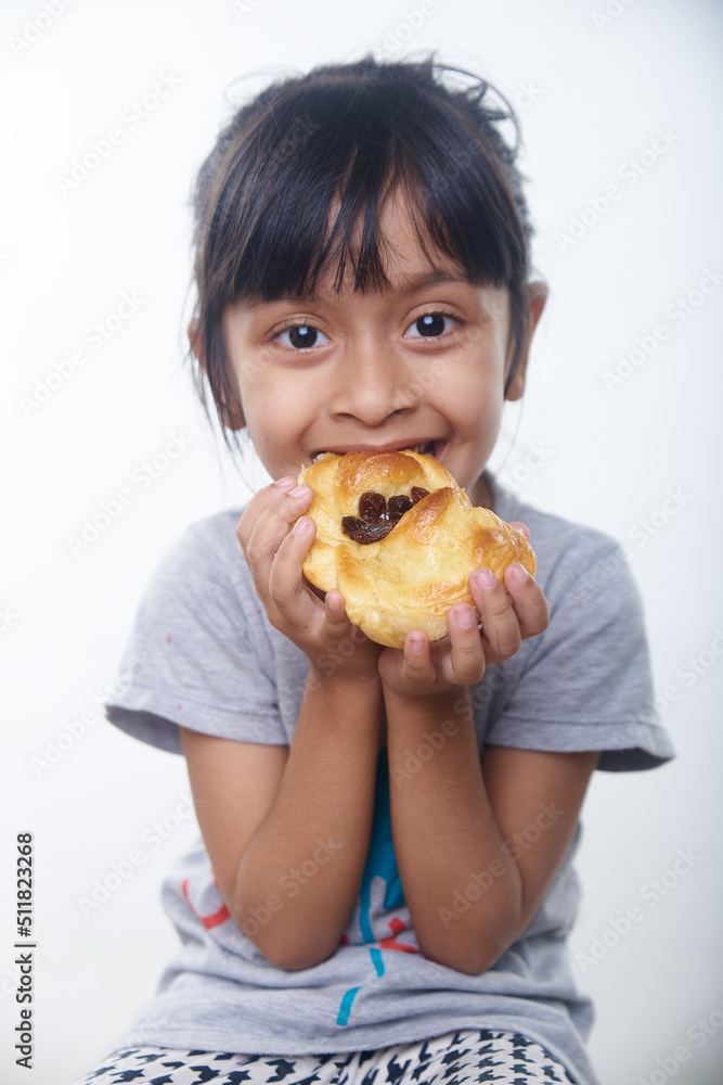 Asian little girl having breakfast in white background Asian little girl having breakfast in white background