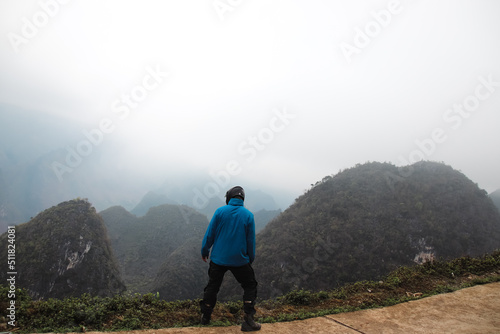 A tourist sightseeing in Dong Van Karst Plateau Geopark in Ha giang Vietnam