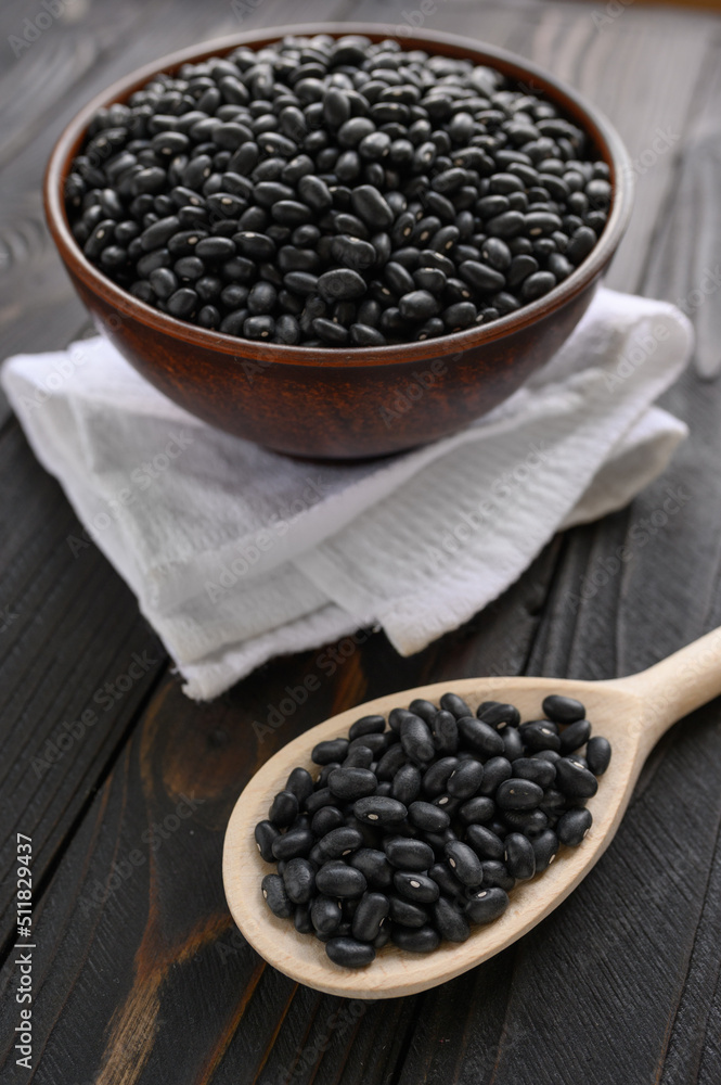 Fresh organic natural beans on wooden rustic black background Fresh organic natural beans on wooden rustic black background