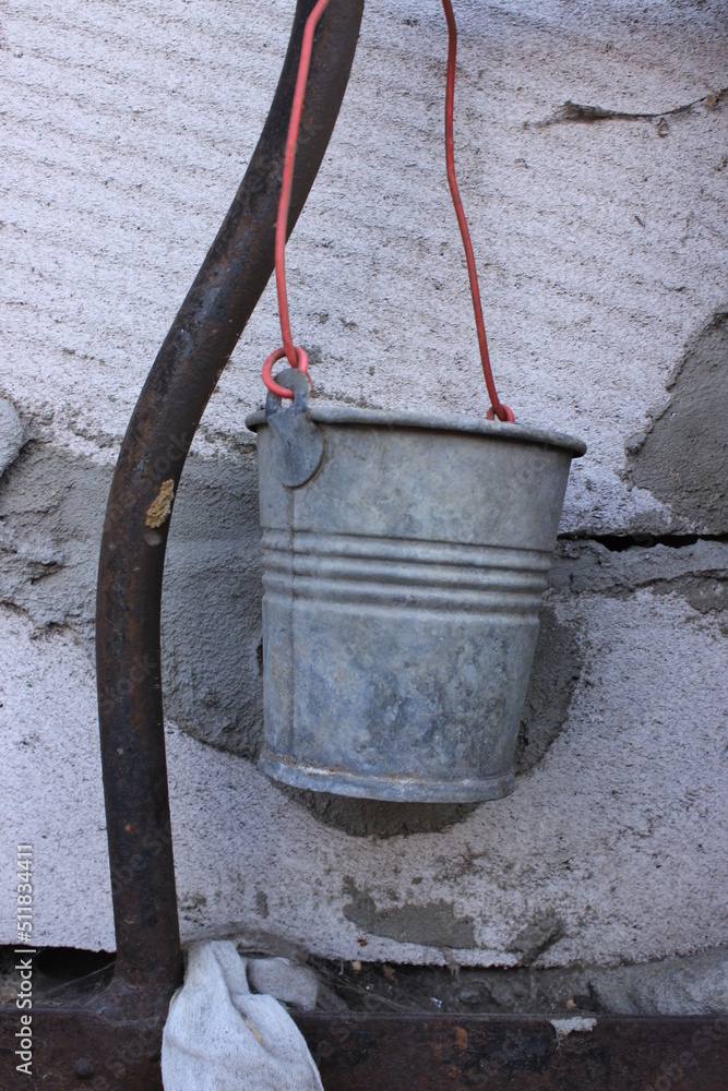 Decorative small old iron bucket.Macro. Decorative small old iron bucket.Macro.