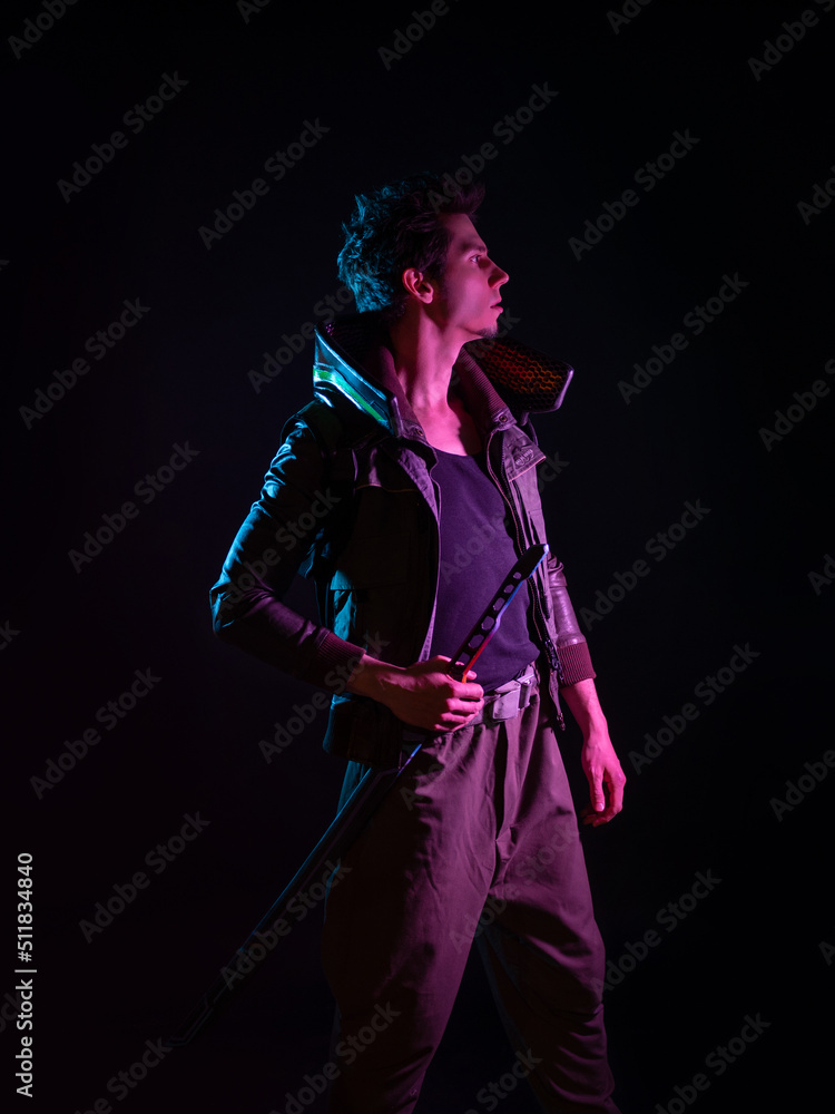 A guy in a cyberpunk image, A young man in neon lighting on a black background