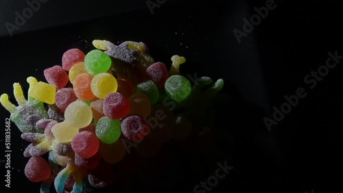 Gummies candies on a black tray photo