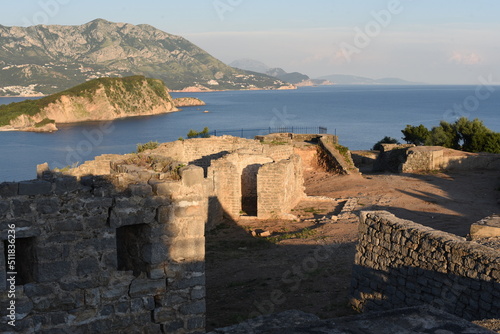 view of the old town city.The walls of the remaining parts of the old town above the sea in the hills. A 2,000-year-old fortress. 2,000-year-old ruins. part of the old ruins in Montenegro. photo