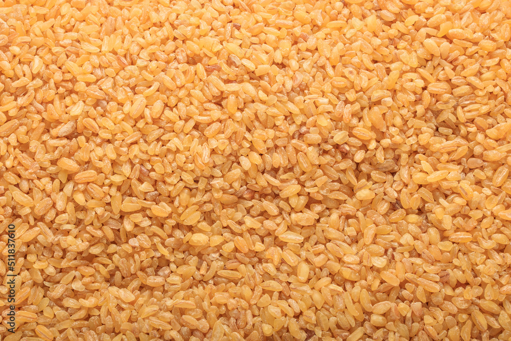 Raw bulgur food background. Dry bulgur grain. Healthy eating. Organic product. Top view. Raw bulgur food background. Dry bulgur grain. Healthy eating. Organic product. Top view.