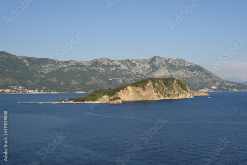 View from the sea. Large sea surface with numerous rocky islands. Mediterranean Blue Sea in Montenegro. Mountain Islands of Montenegro.