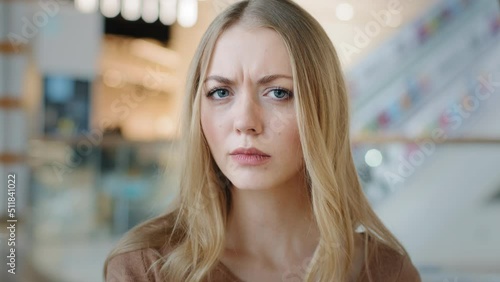 Portrait emotional puzzled Caucasian girl sad upset woman serious answer no wave head negative opinion bad attitude lady not sign ban forbid prohibition disagreement refusal failure rejection reaction photo