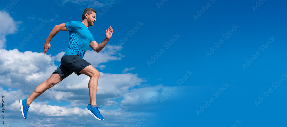 Man running and jumping, banner with copy space. healthy sportsman with muscular body running in sportswear outdoor on sky background, sport