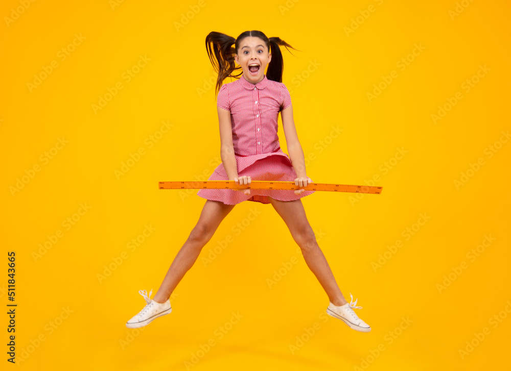 Amazed teenager. Schoolgirl in school uniform hold mathematics measure. Metric measurement. School equipment. Teenager student study stem disciplines. Crazy jump, jumping kids. Excited teen girl. Amazed teenager. Schoolgirl in school uniform hold mathematics measure. Metric measurement. School equipment. Teenager student study stem disciplines. Crazy jump, jumping kids. Excited teen girl.