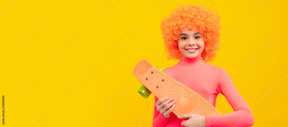 Happy girl scater with orange hair in pink poloneck smile holding pennyboard, skateboarding. Funny teenager child on party, poster banner header with copy space. Happy girl scater with orange hair in pink poloneck smile holding pennyboard, skateboarding. Funny teenager child on party, poster banner header with copy space.
