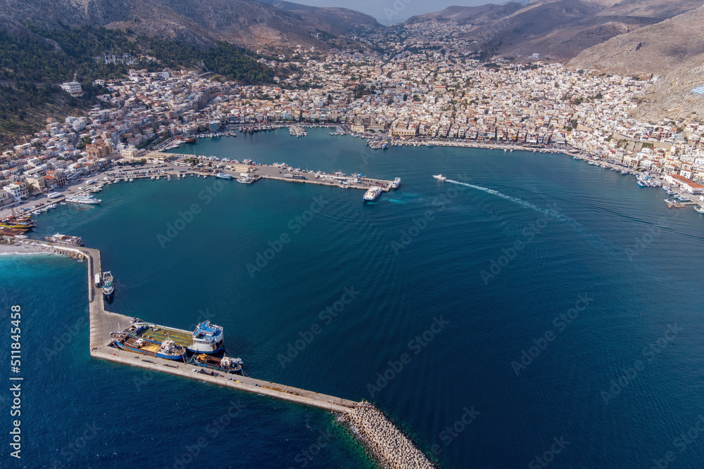 Aerial view of Kalimnos town and its port on sunny day. Kalymnos island, Aegean Sea, Greece.