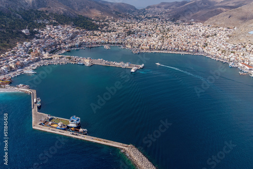 Aerial view of Kalimnos town and its port on sunny day. Kalymnos island, Aegean Sea, Greece. photo