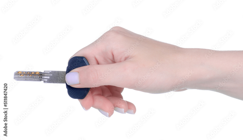 One silver key in hand on white background isolation One silver key in hand on white background isolation