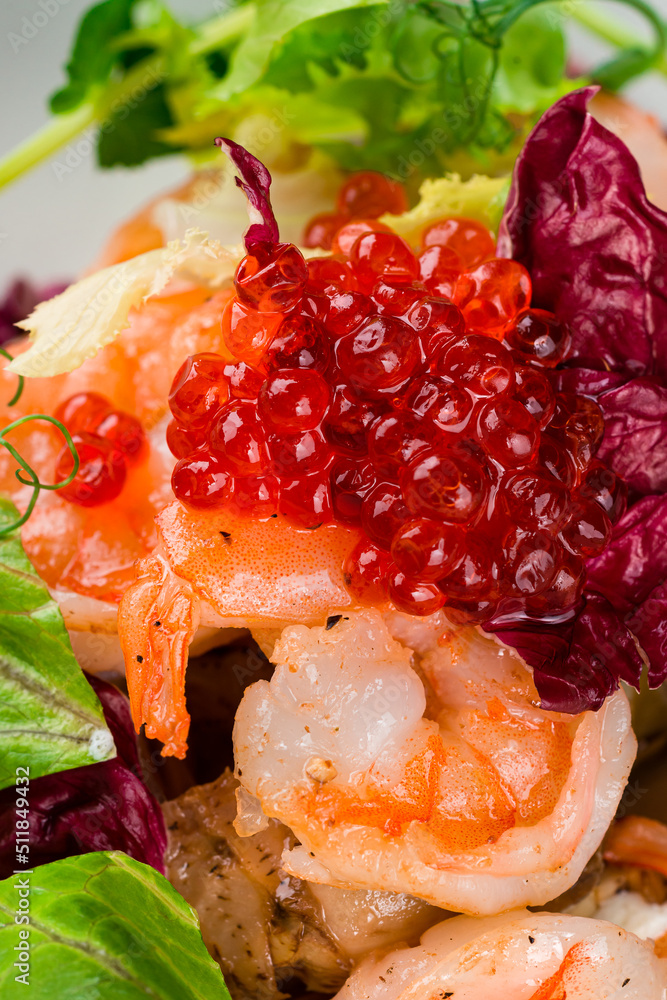 Salad from shrimp tails with lettuce, arugula, cherry tomatoes, avocado, olive oil and balsamic vinegar. Salad from shrimp tails with lettuce, arugula, cherry tomatoes, avocado, olive oil and balsamic vinegar.