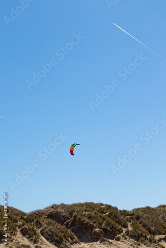 colorful kite in the air over beach