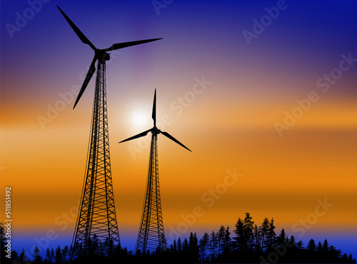 wind power generator silhouettes in forest landscape at sunset