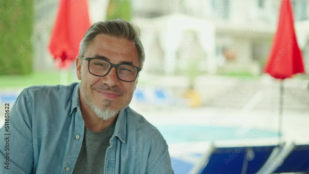 Portrait of happy middle aged man at home in front of house, confident, smiling. Outdoor in garden of villa, residence. Portrait of happy middle aged man at home in front of house, confident, smiling. Outdoor in garden of villa, residence.