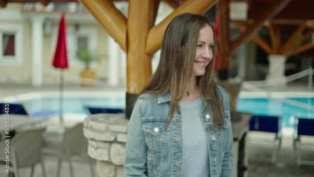 Portrait of real estate agent in front of house, confident, smiling. Happy young woman at home outdoor walking in garden of villa, residence. Portrait of real estate agent in front of house, confident, smiling. Happy young woman at home outdoor walking in garden of villa, residence.