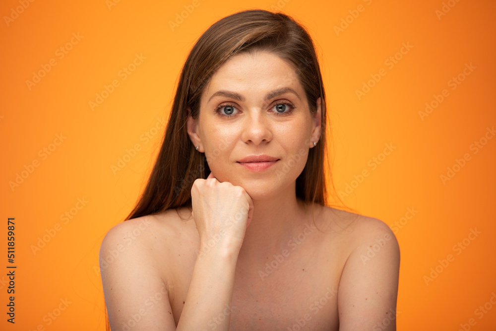 Serious thinking woman with long hair and bared shoulders leaning face on hand. Isolated female person portrait. Serious thinking woman with long hair and bared shoulders leaning face on hand. Isolated female person portrait.