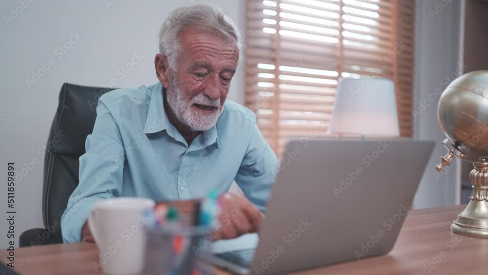 elderly caucasian businessman using laptop to work, old adult mature man using computer on desk in business office, male senior entrepreneur with technology at home workplace to teamwork communication elderly caucasian businessman using laptop to work, old adult mature man using computer on desk in business office, male senior entrepreneur with technology at home workplace to teamwork communication