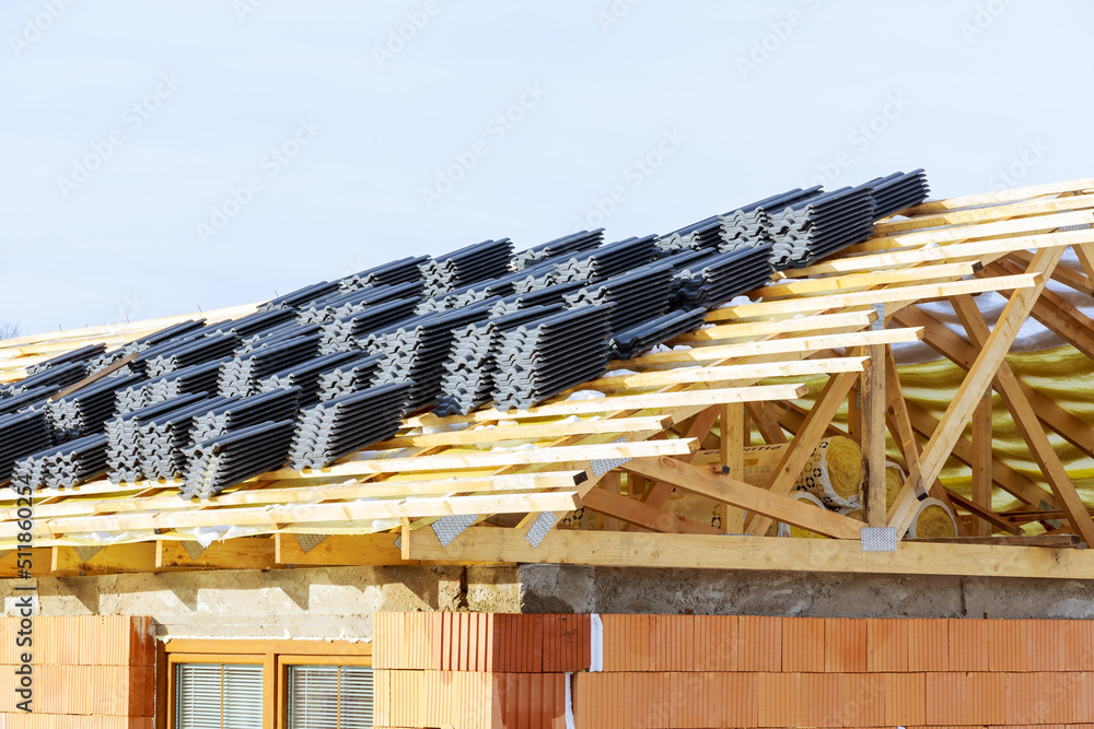 Top view, wooden roof structure of frame beams of the farm house, metal tiles. Top view, wooden roof structure of frame beams of the farm house, metal tiles.
