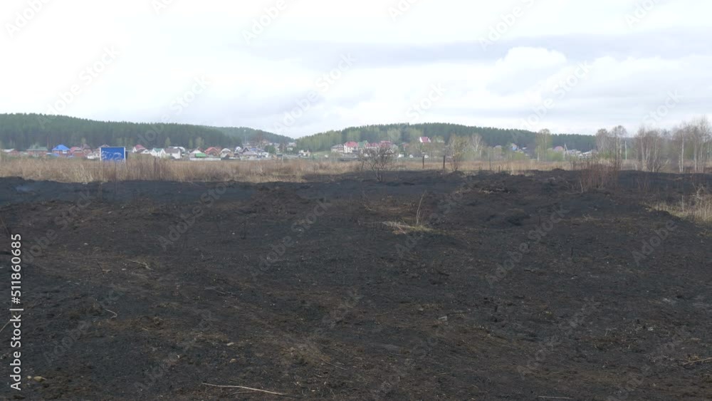Consequences of peat fires near the settlement. Scorched black earth. Human factor in occurrence of fires in forests. Consequences of peat fires near the settlement. Scorched black earth. Human factor in occurrence of fires in forests.