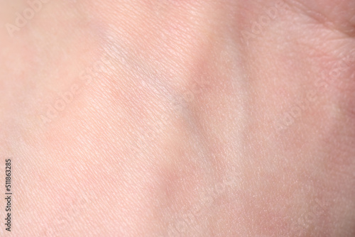 background of a pink skin texture. Healthy skin. Macro photo of skin cells.