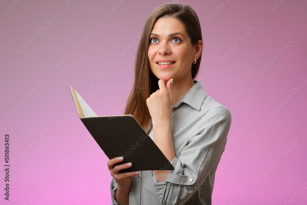 Happy teacher or student woman holding open book and looking up, isolated portrait. Happy teacher or student woman holding open book and looking up, isolated portrait.