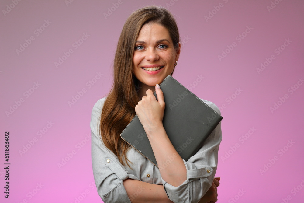Smiling woman teacher or student girl holding book in front of, isolated female portrait. Smiling woman teacher or student girl holding book in front of, isolated female portrait.