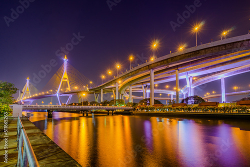 Light up on the highway bridge across the river © Phatara Thitiwimol