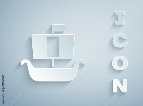 Paper cut Ancient viking scandinavian drakkar icon isolated on grey background. Viking transport ship. Paper art style. Vector