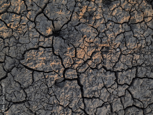 Fotobehang Dry cracked earth, parched land, Earth dirt texture background of brown mud, arid soil, Dry cracked earth texture, cracked earth, Dry mud, broken texture, desert, Global Warming, Climate Change