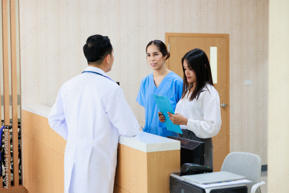 Receptionist and doctor with client. Hospital Healthcare medical and medicine concept. Receptionist and doctor with client. Hospital Healthcare medical and medicine concept.