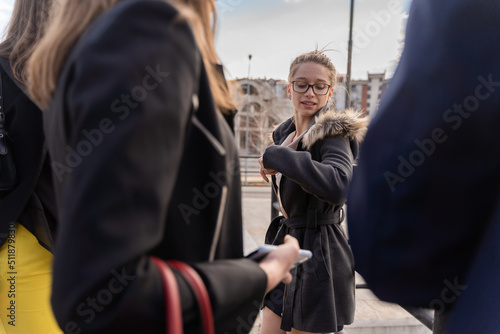 Listening to her co workers while explaining something