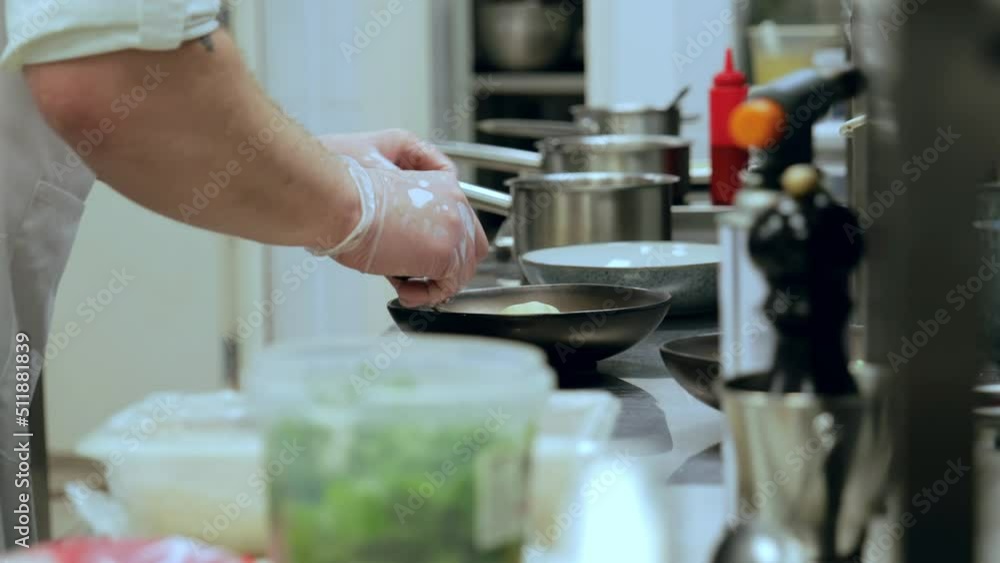 Cooking process. Close up of chef's hands Cooking process. Close up of chef's hands