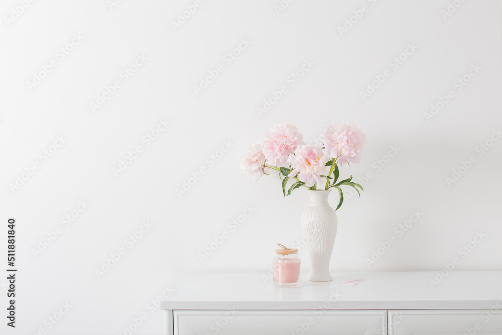 pink peonies in ceramic white vase in white interior pink peonies in ceramic white vase in white interior