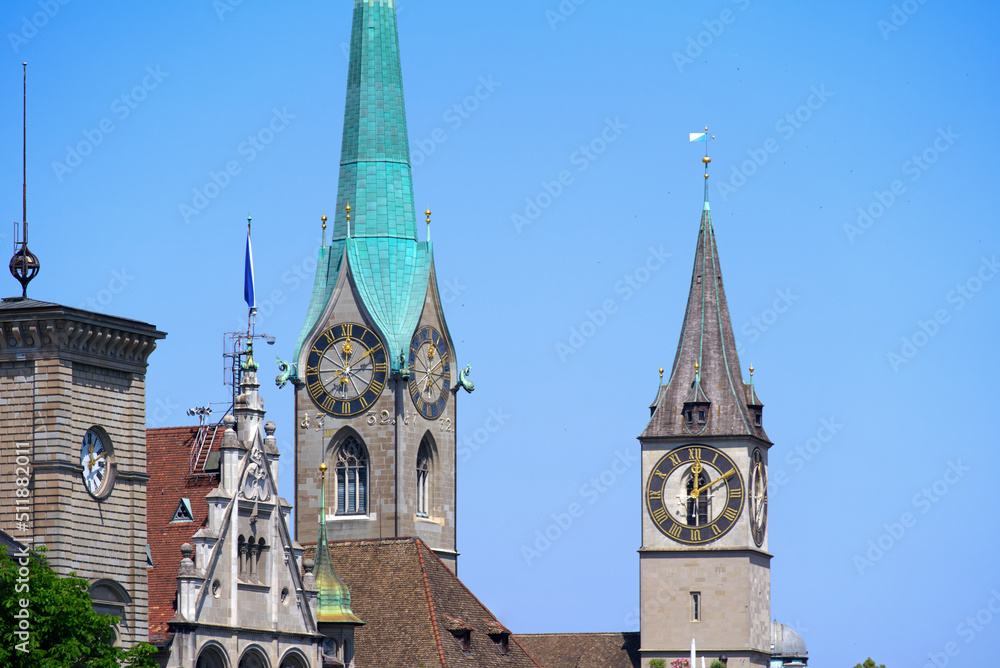 Medieval old town of Zürich with church towers of Women's Minster and St. Peter on a sunny hot summer day. Photo taken June 19th, 2022, Zurich, Switzerland.