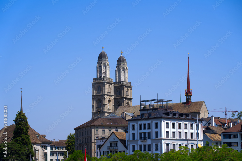 Medieval old town of Zürich with church towers of Great Minster on a sunny hot summer day. Photo taken June 19th, 2022, Zurich, Switzerland.