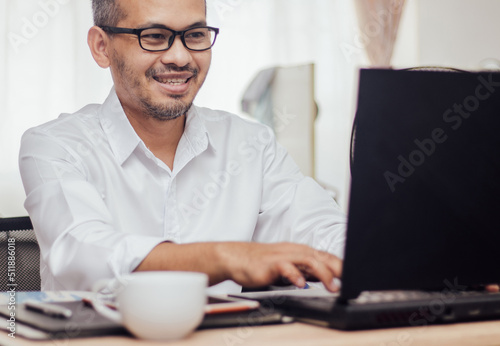 Wallpaper Mural Happy man wearing glasses and smiling Torontodigital.ca