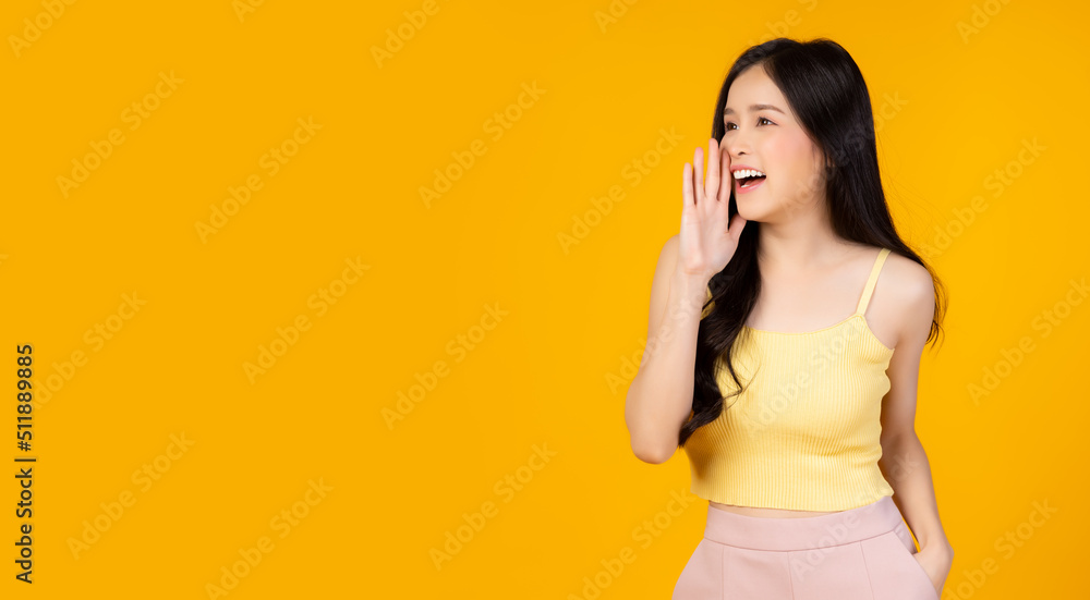 Surprised happy beauty asian woman look at copy space in excitement Expressive facial expressions Presenting some product Beautiful girl act like a telling something Isolated on yellow background Surprised happy beauty asian woman look at copy space in excitement Expressive facial expressions Presenting some product Beautiful girl act like a telling something Isolated on yellow background