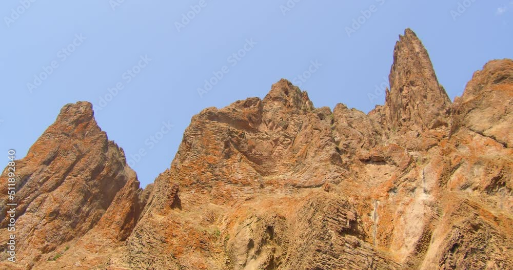 Majestic rocks of volcanic origin against the sky.