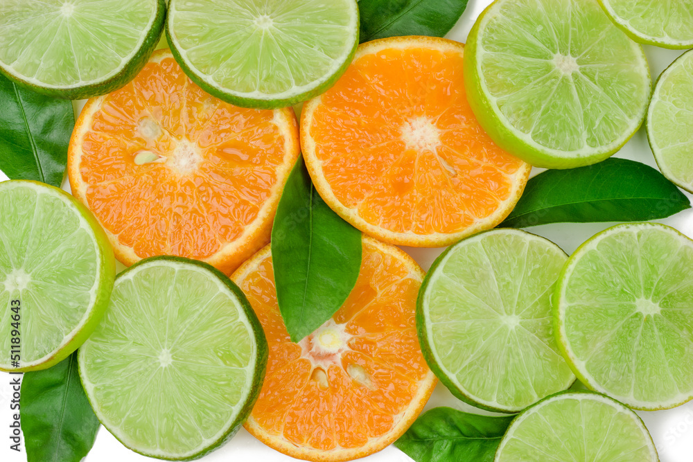 Fototapeta premium The slices of lime and orange isolated on white background