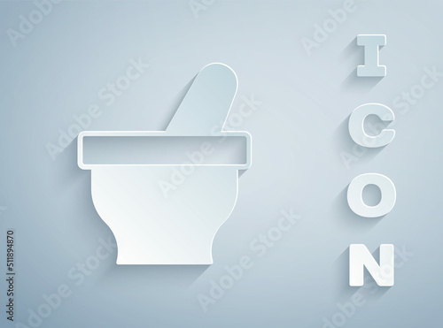 Paper cut Mortar and pestle icon isolated on grey background. Paper art style. Vector