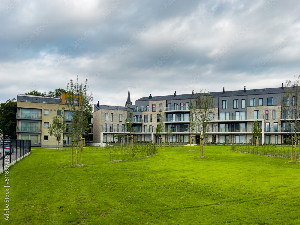 Fototapeta premium Exterior of a building with a green garden outdoors in Bruxelles