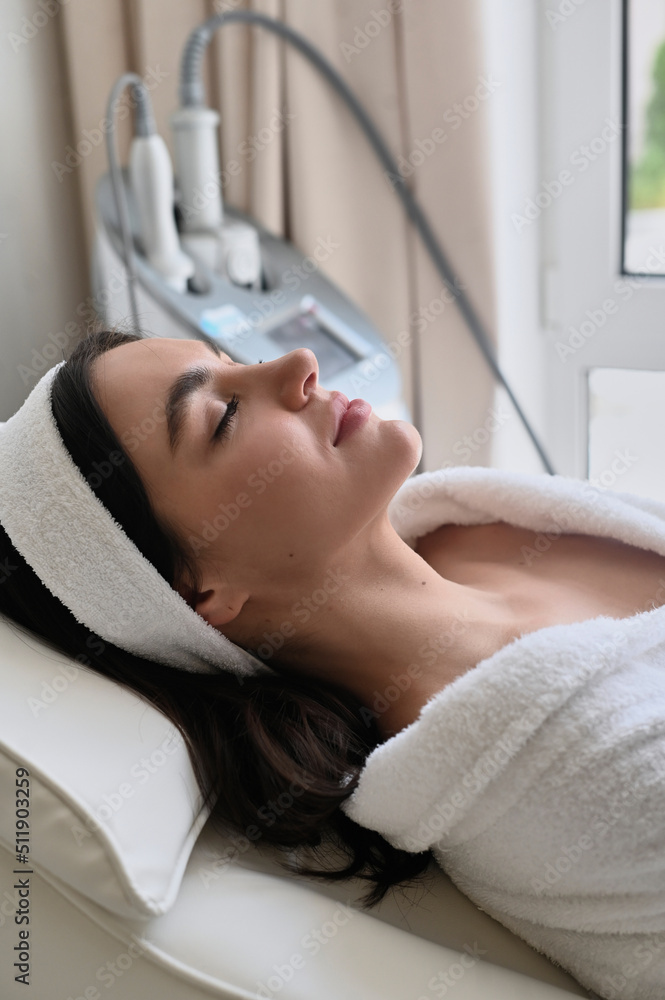 health and beauty, resort and relaxation concept. young woman in spa salon getting face massage health and beauty, resort and relaxation concept. young woman in spa salon getting face massage