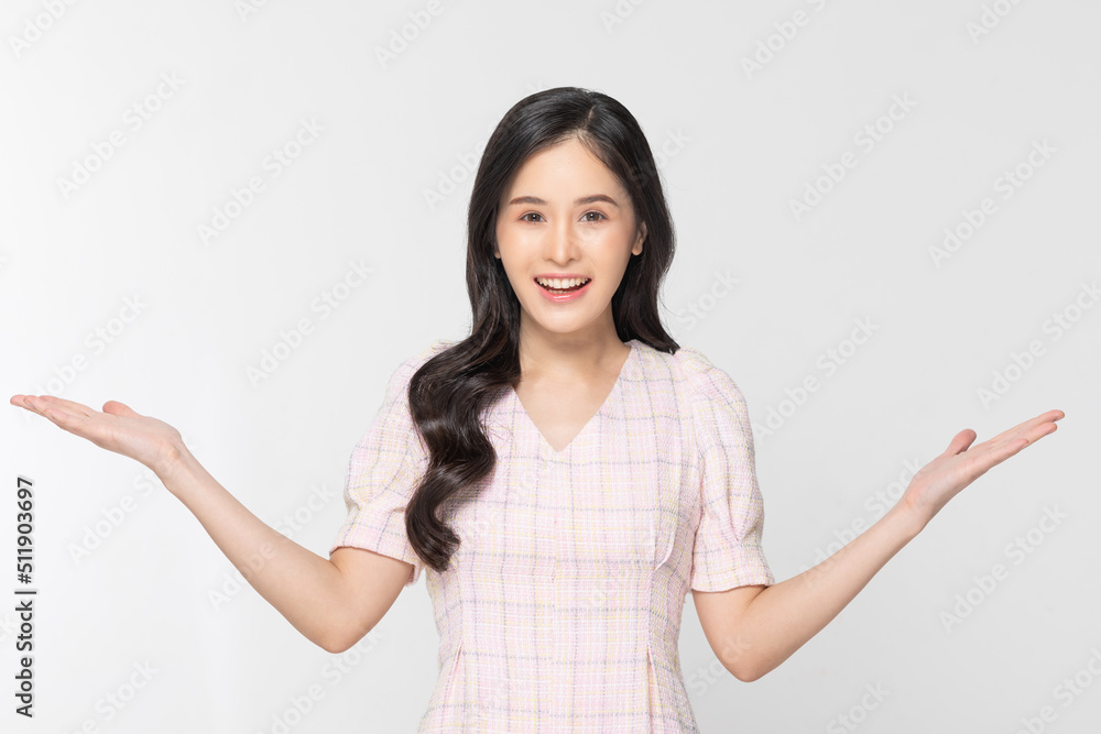 Happy attractive asian young woman smile and open hand palm to copy space isolated on white background. Cheerful pretty girl wear casual dress open palm to empty space for mockup to display product Happy attractive asian young woman smile and open hand palm to copy space isolated on white background. Cheerful pretty girl wear casual dress open palm to empty space for mockup to display product