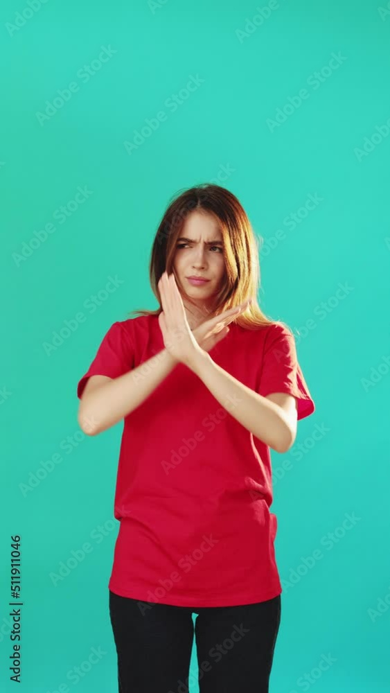 Dislike gesture. Stop sign. Vertical portrait of skeptic woman in red ...