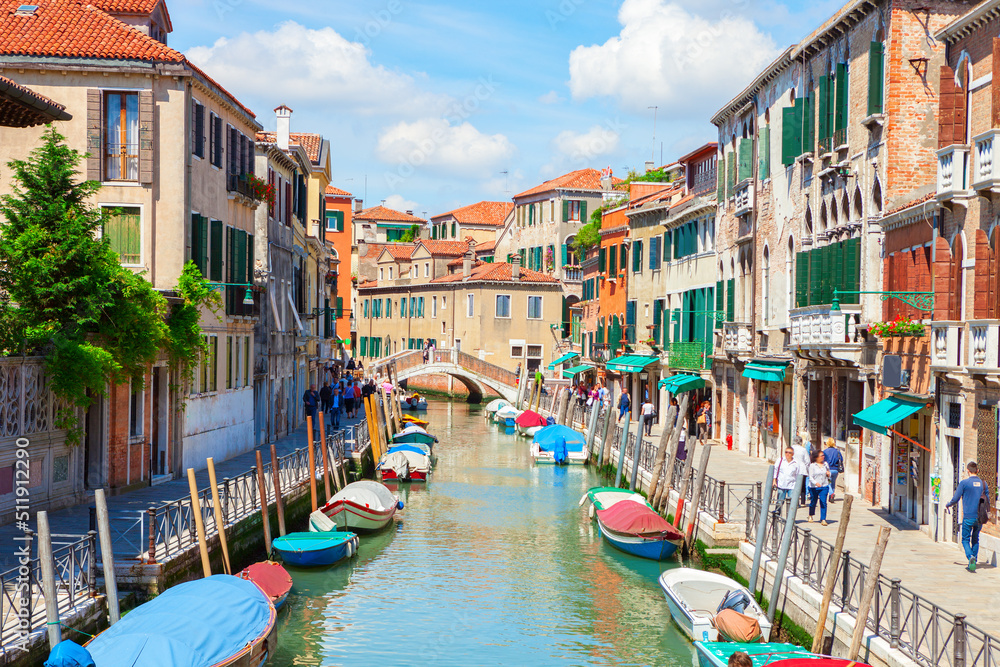 View of colorful canal in Venice on sunny morning, Italy.